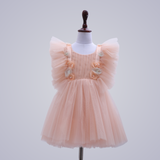 AUDREY DRESS IN PEACH PEARL